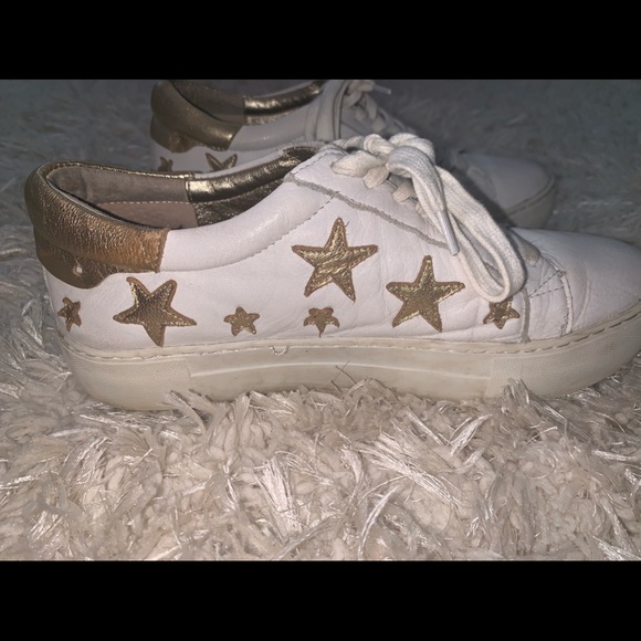 white sneakers with gold stars